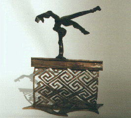  Front view of a Black female nude leaping a wall of Celtic keystone pattern